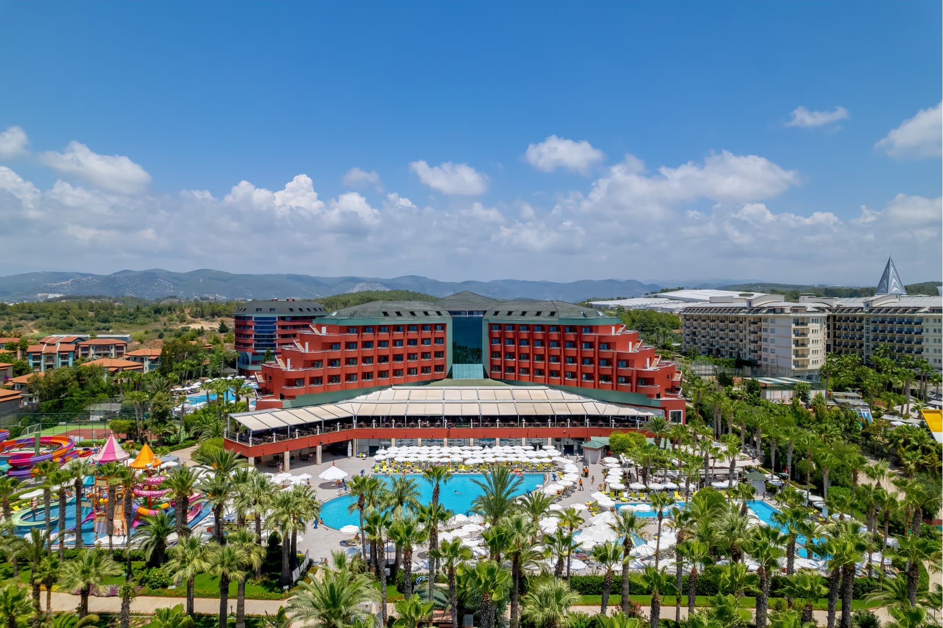 Delphin Deluxe gardens meeting the Alanya coast